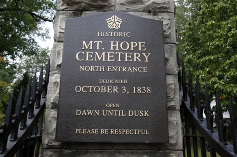 The entrance to Mount Hope Cemetery in Rochester, N.Y. The solitude and even mystical allure of America's oldest municipal park-garden cemetery remains a big draw for permanent residents and visitors alike, among them picnickers, bird watchers, joggers and history buffs.